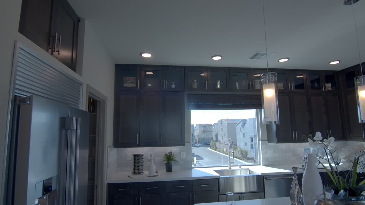 An Elegant Sophisticated Design Of Dining And Kitchen Area In Las Vegas Nevada Wherein Interiors Are Absolutely Simple Yet Beautiful - Wide Shot