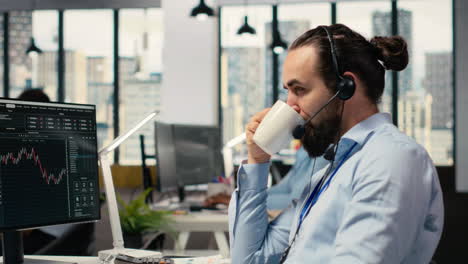 investment consultant talking in headset mic, reviewing client portfolio