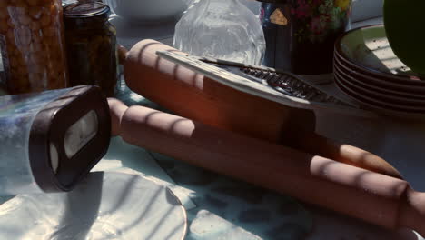 The-swaying-shadows-on-the-kitchen-utensils-haphazardly-strewn-on-the-kitchen-counter