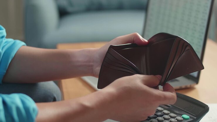 Close Up Of Man'S Hand Holding And Opening The Wallet To Check Money