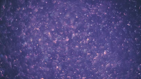 abstract violet background with chaotical motion of transparent soap bubbles. balls rotation, abstract molecular brownian motion.