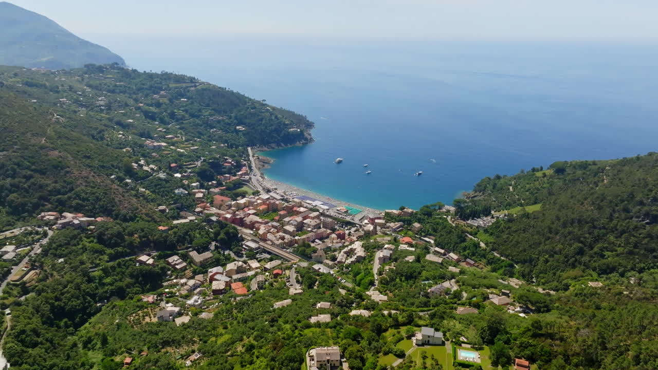 Drone rotating toward Bonassola on the coastline of Liguria, summer in Italy