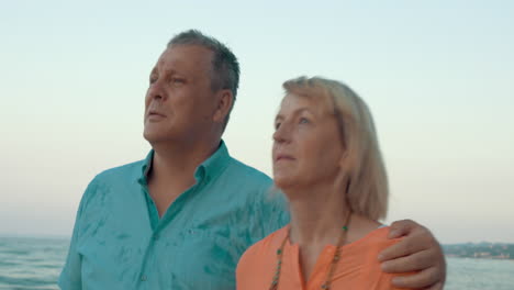 Couple-of-adults-walking-down-the-coastline