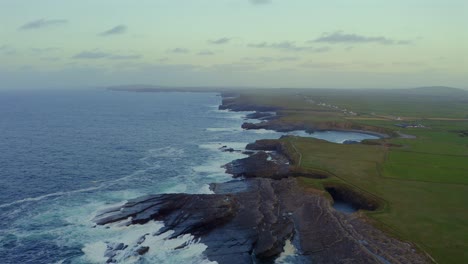 vast aerial view of the kilkee cliffs at sunset