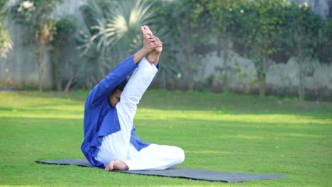 young indian man doing power yoga