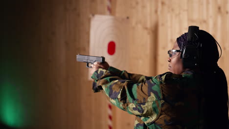 cheerful person in shooting gallery using safety gear to prevent damage