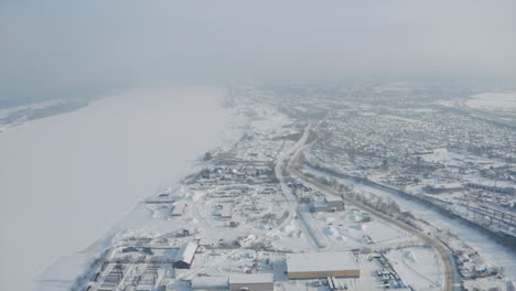 winter aerial view of city and river