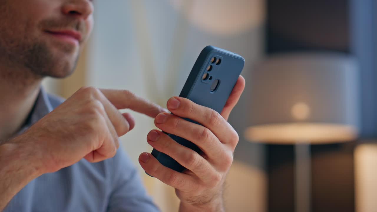 Man hands scrolling smartphone sitting office closeup. Smiling boss swiping
