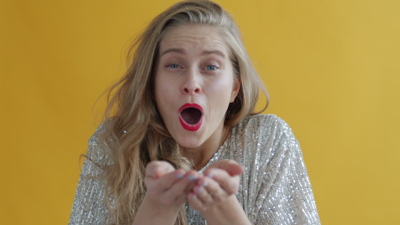 Woman having fun in front of a yellow background