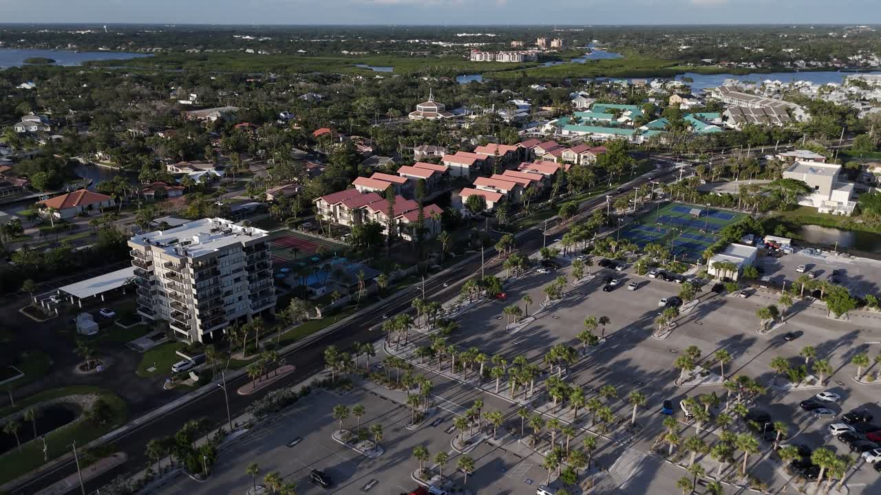 condominiums line the area around Siesta Key Beach and parking lot on the popular beach destination