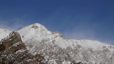 Timelapse:-wind-blowing-in-snow-covered-high-mountains