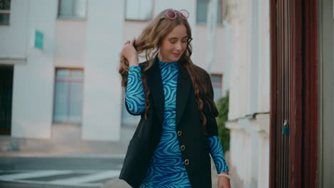 stylish woman walking outdoors