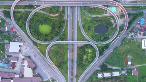 4k time lapse or hyper lapse with zoom out effect : aerial view network or intersection of highway road for transportation or distribution concept background.