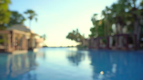 blurred view of empty hotel swimming pool, seamless loop background