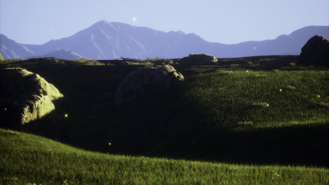 Sparkling fields illuminated by fireflies at dusk near mountain range