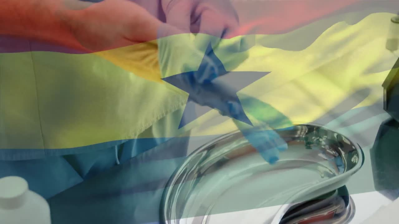 Animation of flag of ghana waving over surgeon in operating theatre