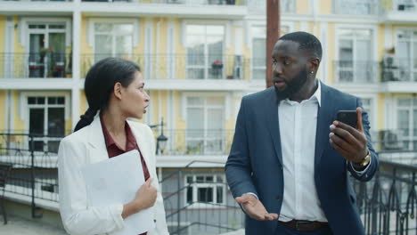 nervous businessman and businesswoman presenting project results on video call