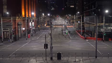 wide shot of an empty city at night shows the incredible impact of the coronavirus outbreak around the world