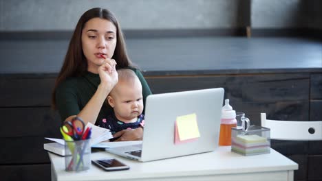 mother working from home with baby