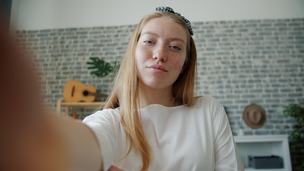 Teenage Girl Taking Selfies at Home