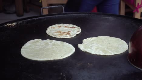 maize tortillas cooked on a comal