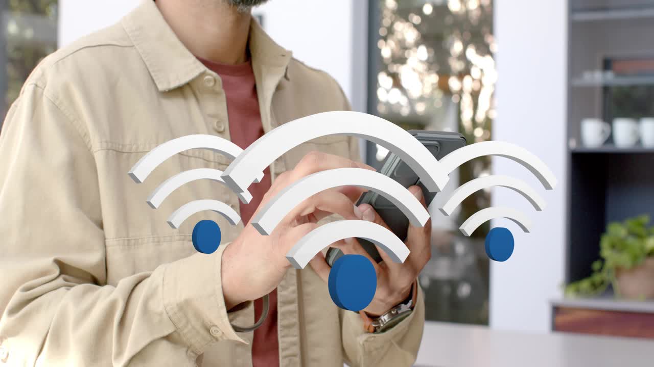 Mid-adult man tapping phone in kitchen, causing animated Wi-Fi symbols growing, testing network