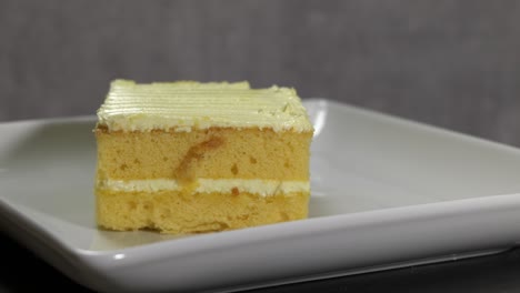 delicious slice of lemon cake on white plate
