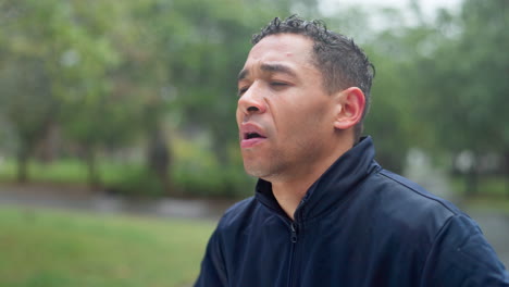 man sweating in the rain