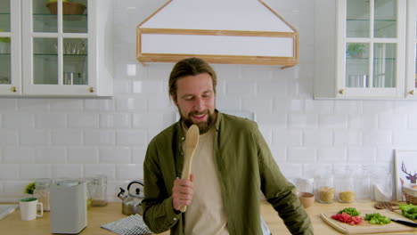 man singing in the kitchen