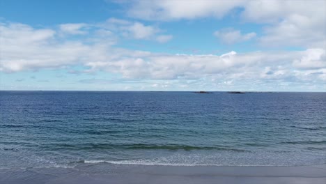 Norwegian beach in bright blue sky with sand