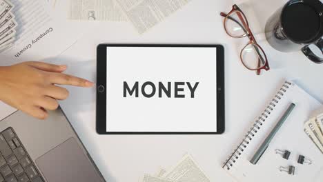 money displaying on a tablet screen