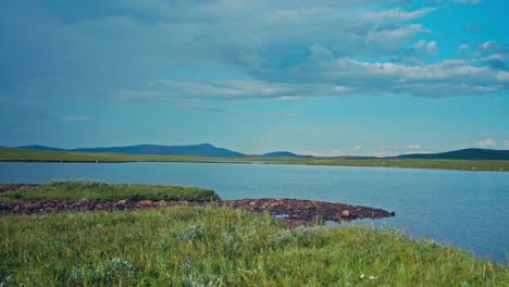 panorama of lake with calm water in summer. - wide shot