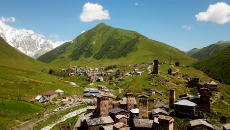 old village landscape of ushguli with medival stone tower house buildings in caucasus nature mountains, rivers and valleys in north east of europe in mestia svaneti georgia, historical architecture