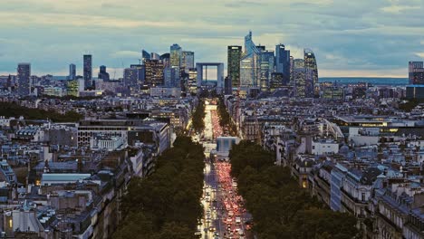 aerial view of la defense, business district in paris, france at dusk. static handheld wide lens shot