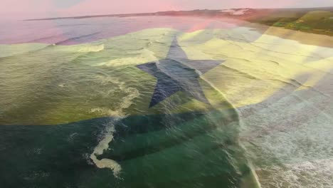 digital composition of waving ghana flag against against aerial view of the sea waves