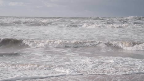 Cinematic-shot-of-waves-breaking-on-a-stormy-day-in-the-North-Sea---Belgium