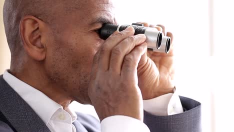 binoculars-looking-through-binoculars-with-white-background-stock-video-stock-footage