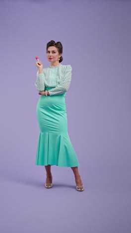 woman in vintage outfit posing with a lollipop