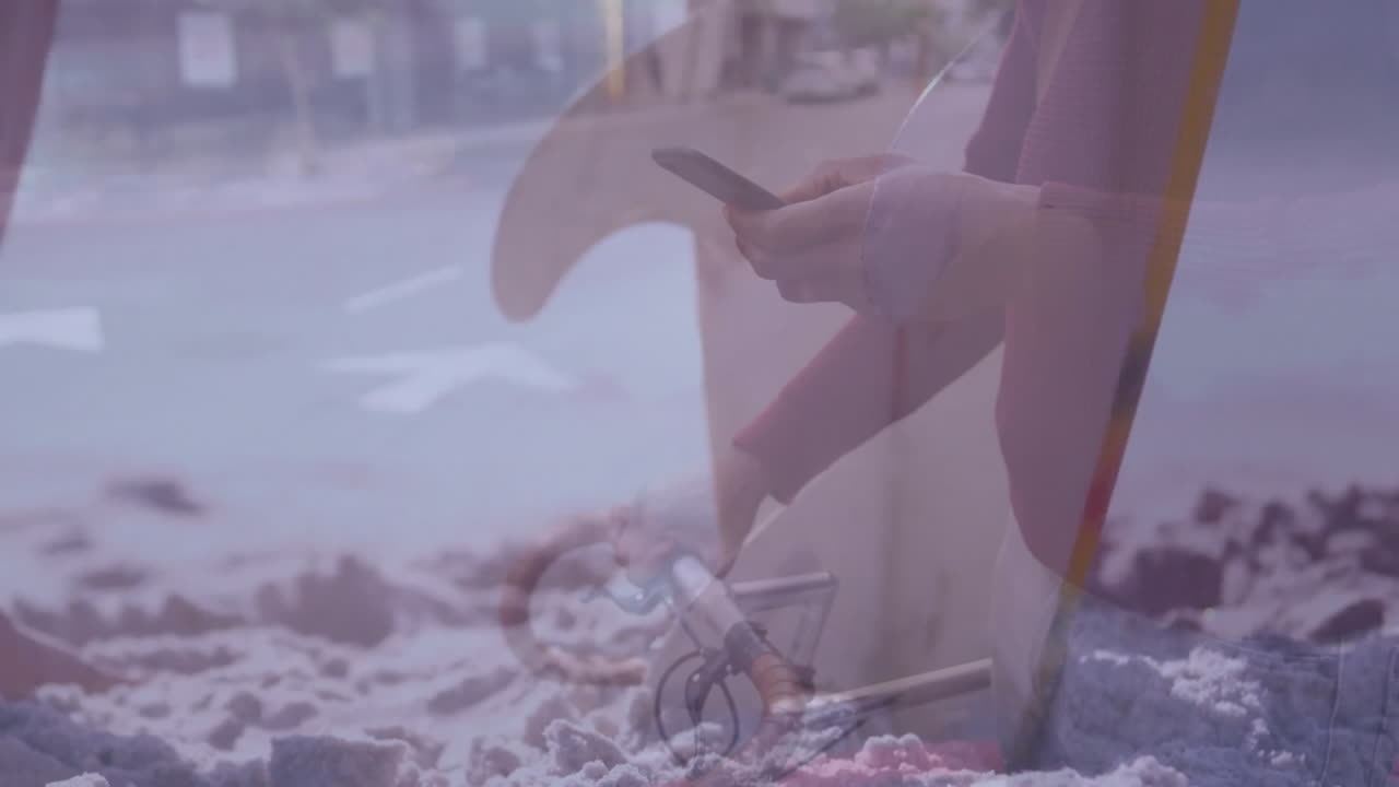 Using smartphone on bicycle in snowy street, blending urban and digital life