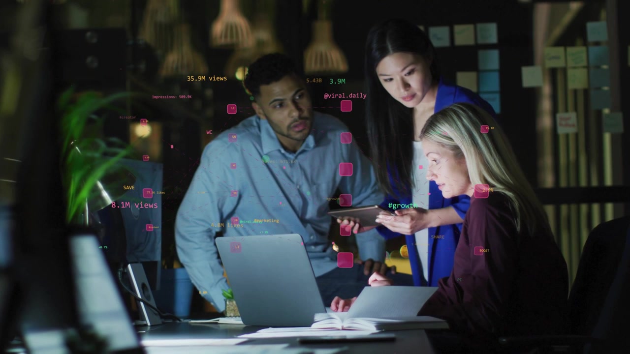 Woman showing phone, overlays appearing, team checking laptop notes metrics, planning marketing