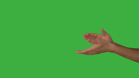 hands clapping over green background