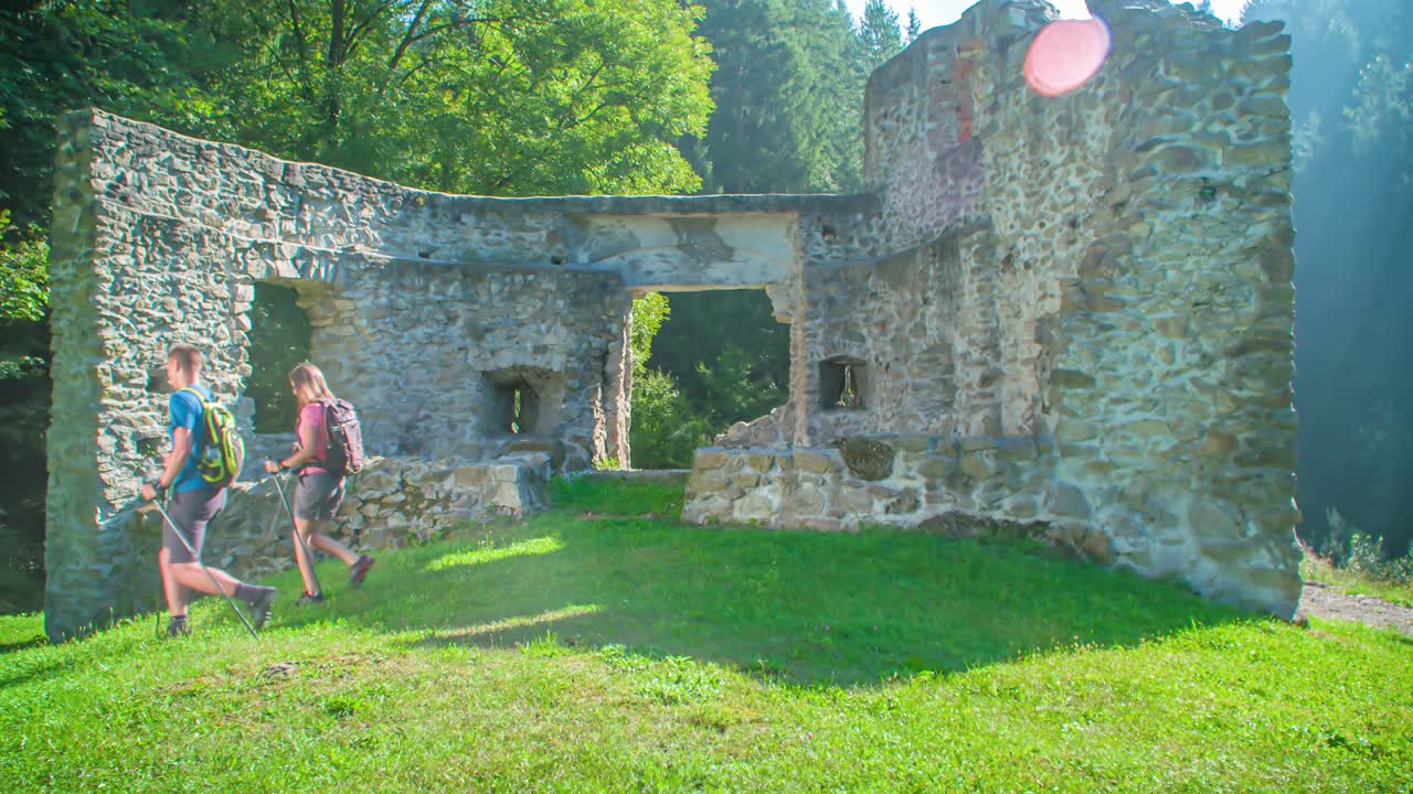Tourist Hiker Couple Explore Ancient Ruins In Vuzenica, Slovenia