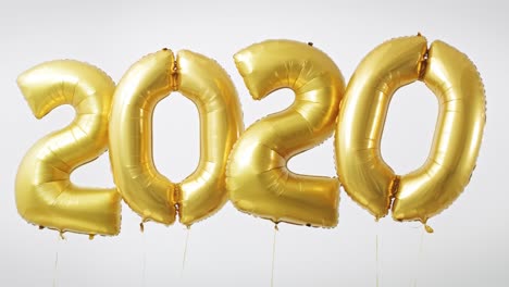 the figure „2020” made of golden balloons