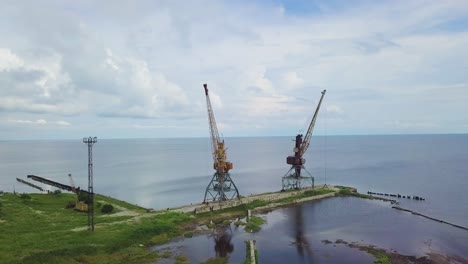 two old rusty cranes in the seaport 02