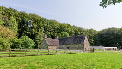 stone building surrounded by lush green landscape