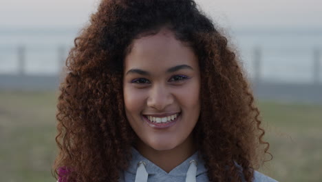 portrait-beautiful-mixed-race-woman-smiling-enjoying-successful-vacation-lifestyle-relaxing-young-female-looking-happy-on-seaside-background-frizzy-hairstyle