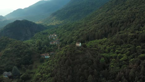 aerial: aerial: flying over chapel perched on mountain top