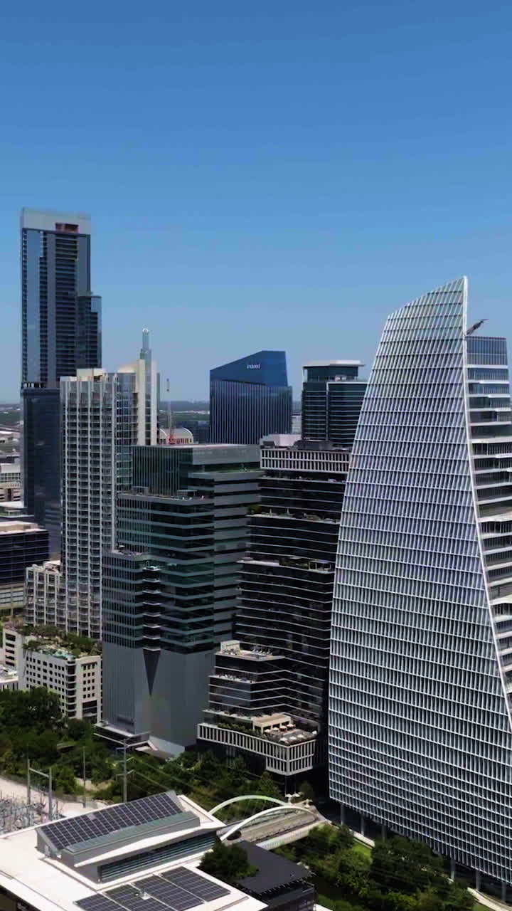 Vertical drone shot in front of skyscrapers in downtown Austin, in sunny Texas, USA