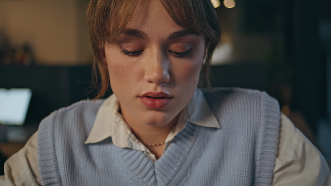 Involved secretary working night reading closeup. Late worker staring computer