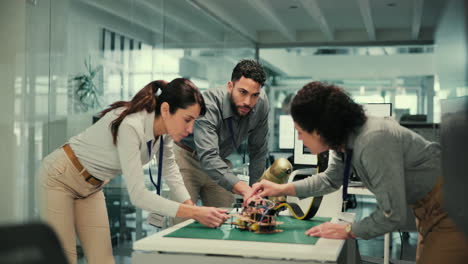 team of engineers working on a project in an office